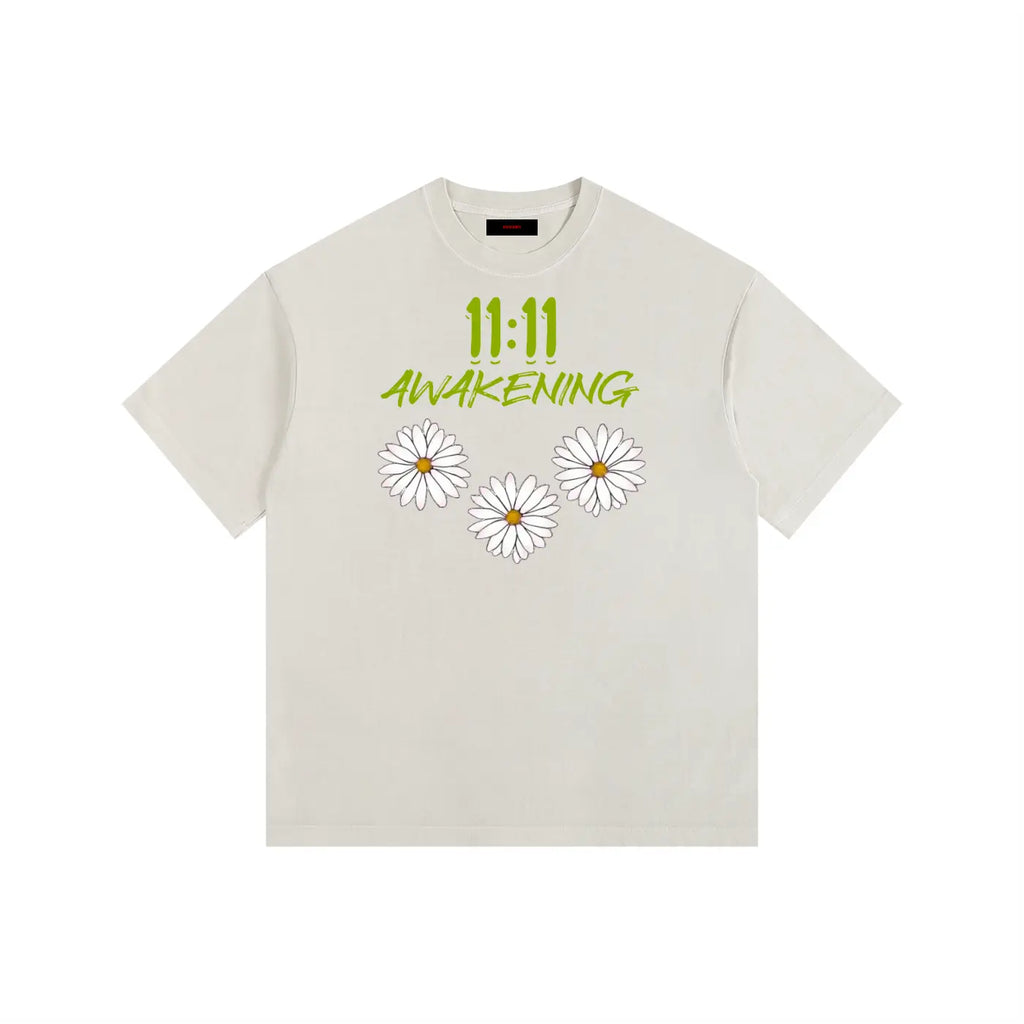 Celestial beige t-shirt with '11:11 Awakening' text and daisy flowers on a white background