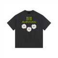 Celestial Black t-shirt with '11:11 Awakening' text and daisy flowers on a white background